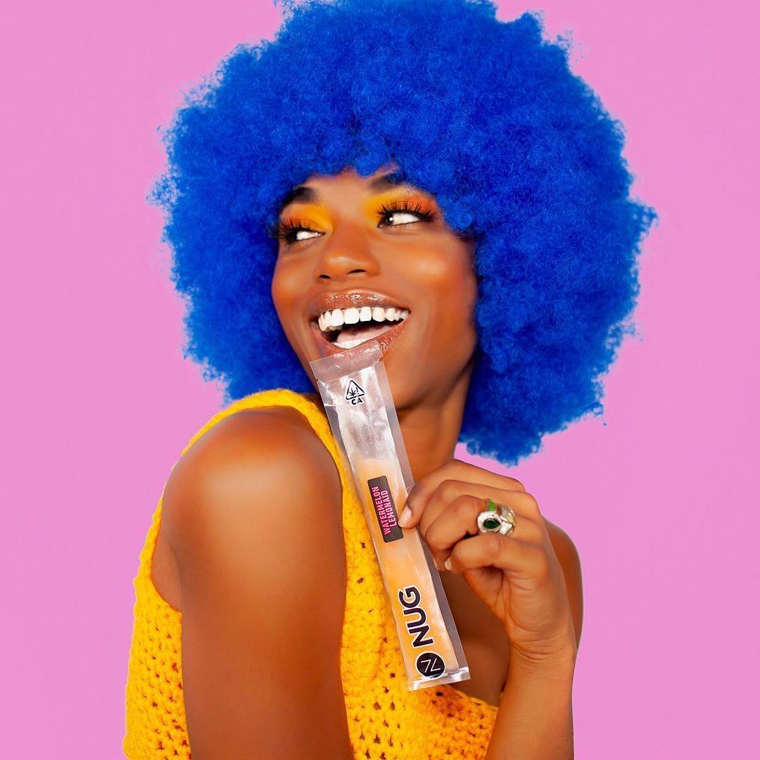 Colorful campaign portrait against a pink background